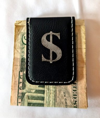 Black magnetic money clip with silver engraving. This item can be engraved front and back.