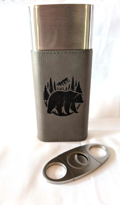 Gray cigar holder with black grizzly engraving. Includes the cutter.