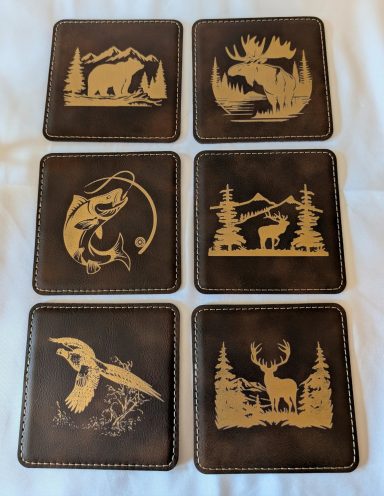 Rawhide leatherette coasters with gold engraving. This is the Montana Outdoorsman theme.