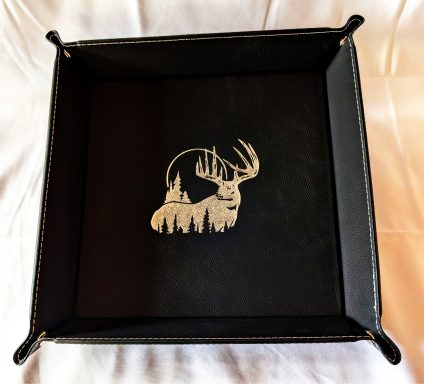 Black "catch-all" tray with gold stag engraving.